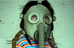 little girl with a gas mask on